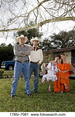 Portrait of a Tex-Mex family with adult children in front yard of house View Large Photo Image Stock Image - Portrait of a Tex-Mex family with adult children in front yard of house. Fotosearch
