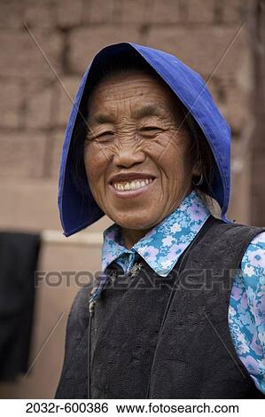 Stock Photograph - Portrait of a woman smiling, Kunming, Yunnan Province, China. Fotosearch