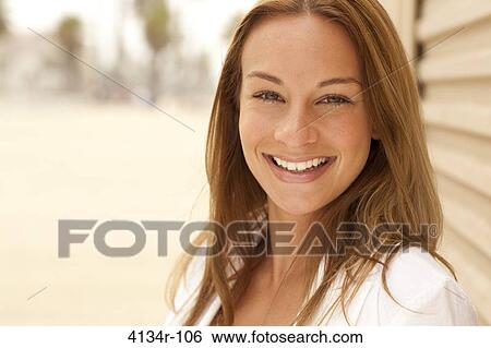 Stock Photograph - Portrait of a woman smiling, Santa Monica Beach, Santa Monica, California, USA. Fotosearch