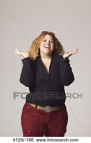 Portrait of a young woman laughing View Large Photo Image Stock Photograph - Portrait of a young woman laughing. Fotosearch