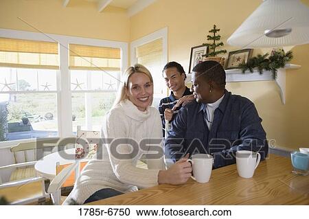 Portrait of an interracial family at home View Large Photo Image Stock Image - Portrait of an interracial family at home. Fotosearch