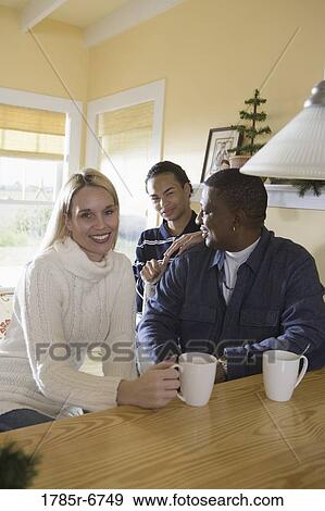 Portrait of an interracial family at home View Large Photo Image Stock Photo - Portrait of an interracial family at home. Fotosearch
