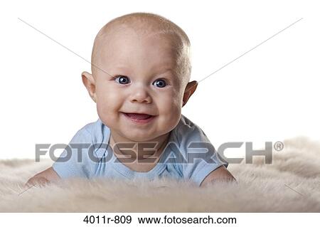 Portrait of baby boy lying on sheep fur View Large Photo Image Stock Photo - Portrait of baby boy lying on sheep fur. Fotosearch