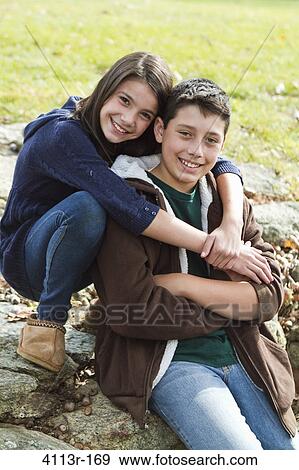 Portrait of brother and sister outdoors View Large Photo Image Stock Photo - Portrait of brother and sister outdoors. Fotosearch