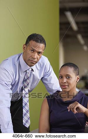 Stock Image - Portrait of business couple. Fotosearch