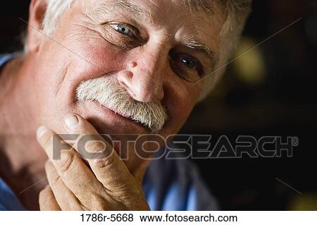 Stock Photo - Portrait of content senior man. Fotosearch