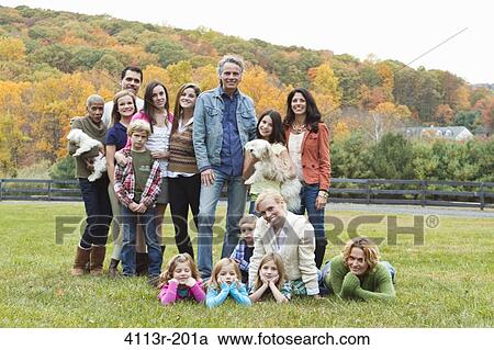 Portrait of families with children and dogs on field View Large Photo Image Stock Image - Portrait of families with children and dogs on field. Fotosearch