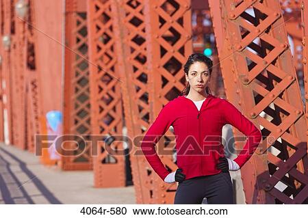 Portrait of female runner on bridge View Large Photo Image Stock Image - Portrait of female runner on bridge. Fotosearch