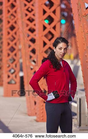 Portrait of female runner on bridge View Large Photo Image Stock Photograph - Portrait of female runner on bridge. Fotosearch