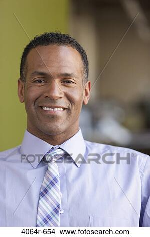 Portrait of smiling businessman View Large Photo Image Picture - Portrait of smiling businessman. Fotosearch