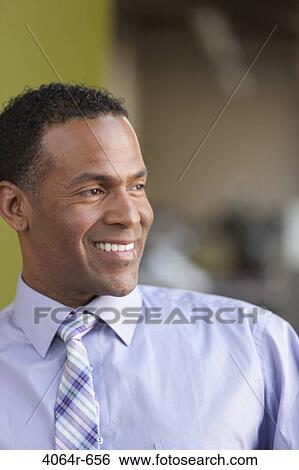 Portrait of smiling businessman View Large Photo Image Stock Photograph - Portrait of smiling businessman. Fotosearch