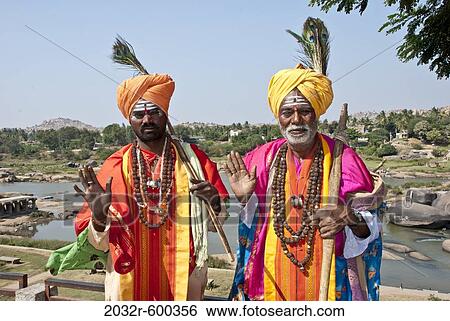 Stock Photograph - Portrait of two sadhus blessing, Hampi, Karnataka, India. Fotosearch