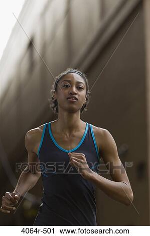 Portrait of woman jogging View Large Photo Image Stock Image - Portrait of woman jogging. Fotosearch