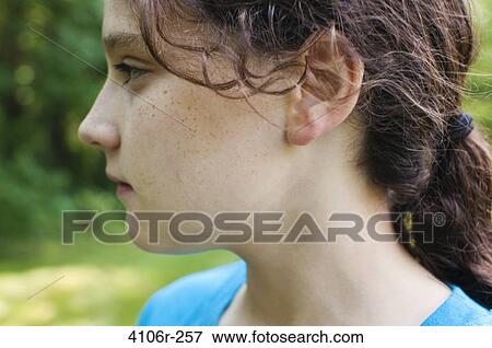Profile of girl outdoors View Large Photo Image Stock Photo - Profile of girl outdoors. Fotosearch
