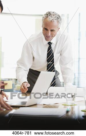 Project discussions amongst employees in boardroom View Large Photo Image Stock Image - Project discussions amongst employees in boardroom. Fotosearch