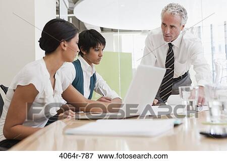 Project discussions amongst employees in boardroom View Large Photo Image Stock Photo - Project discussions amongst employees in boardroom. Fotosearch
