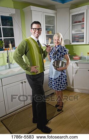 Retro couple at home in kitchen View Large Photo Image Stock Image - Retro couple at home in kitchen. Fotosearch