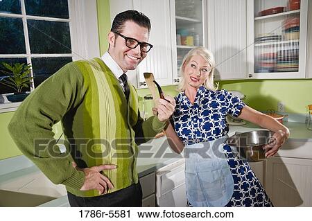 Stock Image - Retro couple enjoying domestic life. Fotosearch