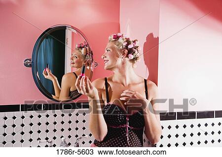 Retro pin-up girl with curlers in hair View Large Photo Image Stock Image - Retro pin-up girl with curlers in hair. Fotosearch