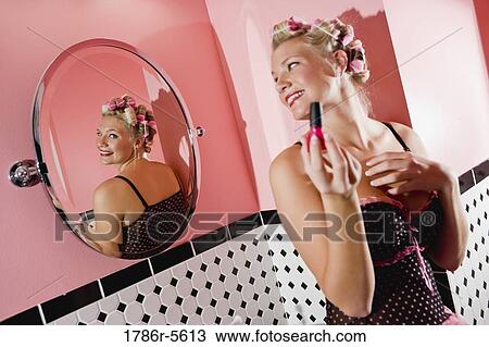 Retro pin-up girl with curlers in hair View Large Photo Image Stock Image - Retro pin-up girl with curlers in hair. Fotosearch