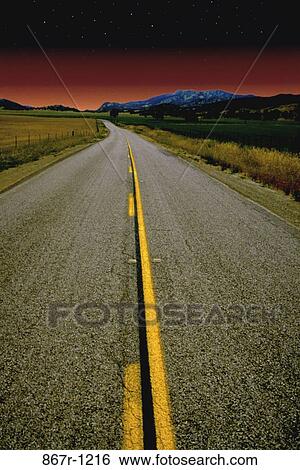 Road and mountains at night View Large Photo Image Stock Photograph - Road and mountains at night. Fotosearch
