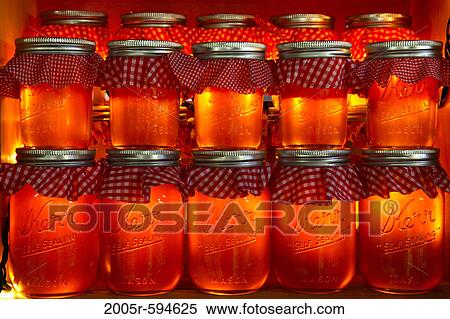 Rows of mason jars with apple cider View Large Photo Image Stock Photography - Rows of mason jars with apple cider. Fotosearch
