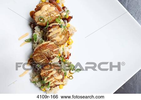 Scallops served with fried rice View Large Photo Image Stock Photograph - Scallops served with fried rice. Fotosearch
