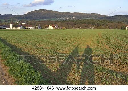 Shadow of two people at farm, Bavaria, Germany View Large Photo Image Stock Photograph - Shadow of two people at farm, Bavaria, Germany. Fotosearch