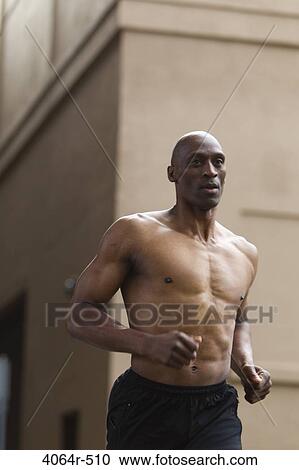 Shirtless man jogging View Large Photo Image Stock Image - Shirtless man jogging. Fotosearch