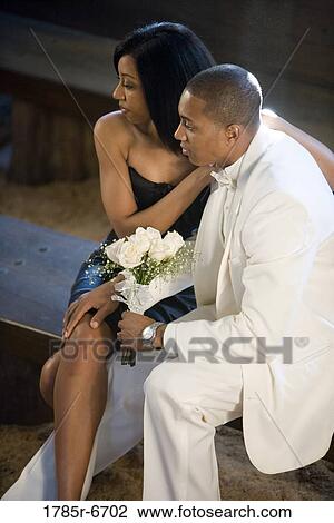 Side view of young couple in formal attire View Large Photo Image Stock Image - Side view of young couple in formal attire. Fotosearch