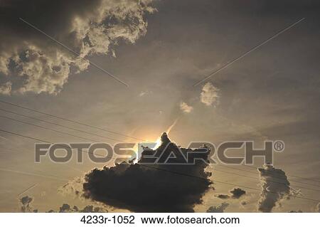 Silhouette of a cloud with sun behind View Large Photo Image Stock Image - Silhouette of a cloud with sun behind. Fotosearch