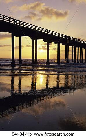Stock Image - Silhouette of a pier during sunset, Scripps Pier, San Diego, California, USA. Fotosearch