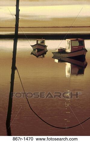 Silhouette of two boats in the sea during sunset View Large Photo Image Stock Image - Silhouette of two boats in the sea during sunset. Fotosearch