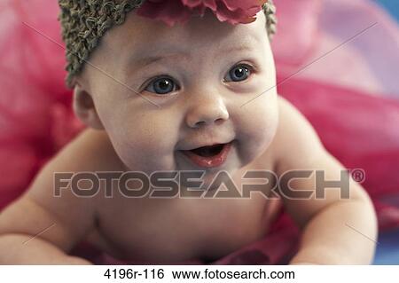 Smiling baby girl, front view View Large Photo Image Stock Photograph - Smiling baby girl, front view. Fotosearch