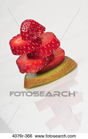 Stack with slices of strawberry and kiwi fruit View Large Photo Image Stock Photograph - Stack with slices of strawberry and kiwi fruit. Fotosearch