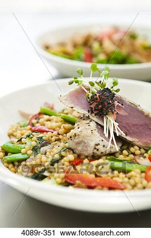 Stir-fried pearl past with vegetables and yellowfintuna with sprouts, studio shot View Large Photo Image Stock Image - Stir-fried pearl past with vegetables and yellowfintuna with sprouts, studio shot. Fotosearch