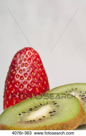 Strawberry and slices of kiwi fruit View Large Photo Image Stock Image - Strawberry and slices of kiwi fruit. Fotosearch