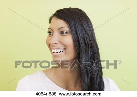 Stock Photo - Studio portrait of businesswoman smiling. Fotosearch