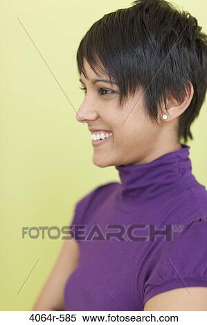Stock Photography - Studio portrait of businesswoman smiling. Fotosearch