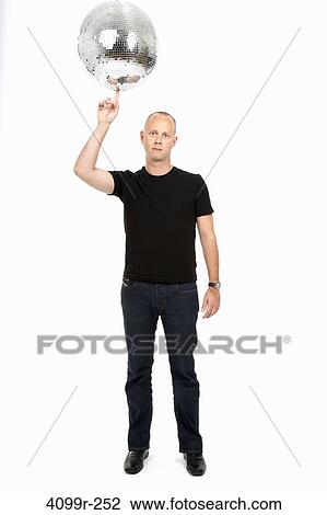 Studio portrait of man balancing mirror ball all finger View Large Photo Image Stock Image - Studio portrait of man balancing mirror ball all finger. Fotosearch
