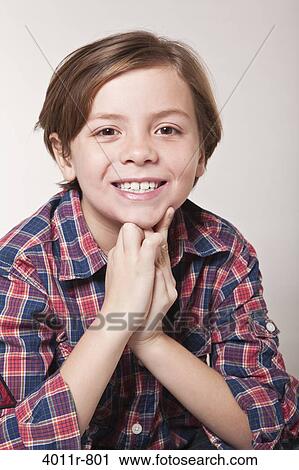 Studio portrait of smiling boy View Large Photo Image Stock Image - Studio portrait of smiling boy. Fotosearch