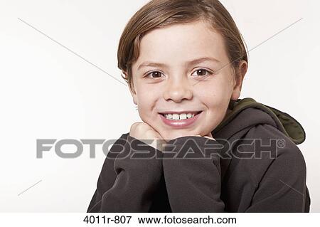 Studio portrait of smiling boy View Large Photo Image Stock Photo - Studio portrait of smiling boy. Fotosearch