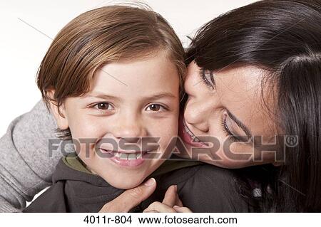 Studio portrait of smiling woman with son View Large Photo Image Picture - Studio portrait of smiling woman with son. Fotosearch