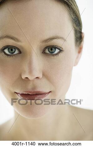 Studio portrait of young woman wearing makeup View Large Photo Image Stock Image - Studio portrait of young woman wearing makeup. Fotosearch