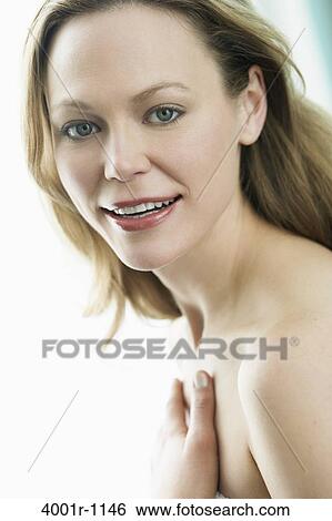 Studio portrait of young woman wearing makeup View Large Photo Image Stock Photograph - Studio portrait of young woman wearing makeup. Fotosearch