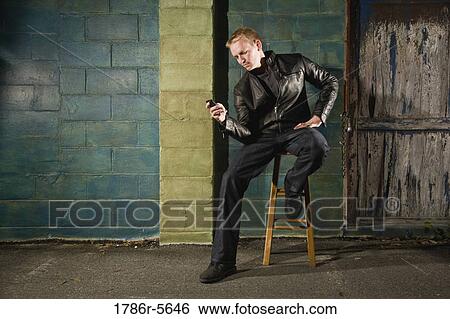 Stock Photograph - Stylish man with mobile phone. Fotosearch