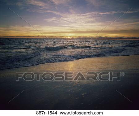 Sunset over a beach, Panama City Beach, Florida, USA View Large Photo Image Picture - Sunset over a beach, Panama City Beach, Florida, USA. Fotosearch