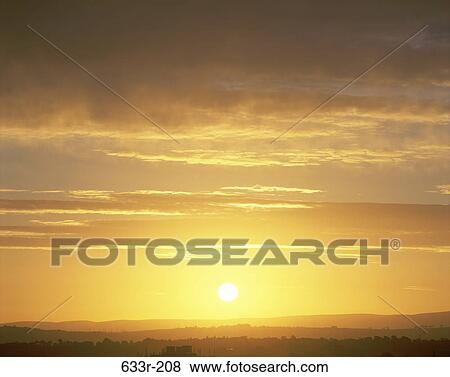 Sunset over a landscape View Large Photo Image Stock Photo - Sunset over a landscape. Fotosearch
