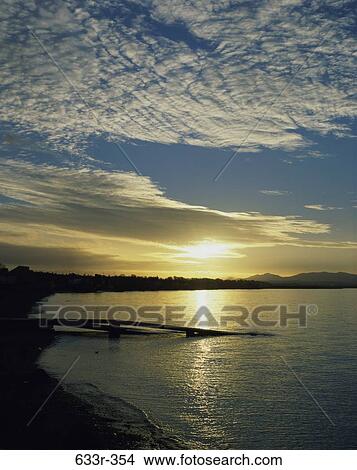 Sunset over the ocean, Firth of Forth, Scotland View Large Photo Image Picture - Sunset over the ocean, Firth of Forth, Scotland. Fotosearch