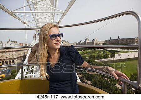Teenage girl in a ferris wheel, Grande Roue de Paris, Paris, Ile-de-France, France View Large Photo Image Stock Photo - Teenage girl in a ferris wheel, Grande Roue de Paris, Paris, Ile-de-France, France. Fotosearch